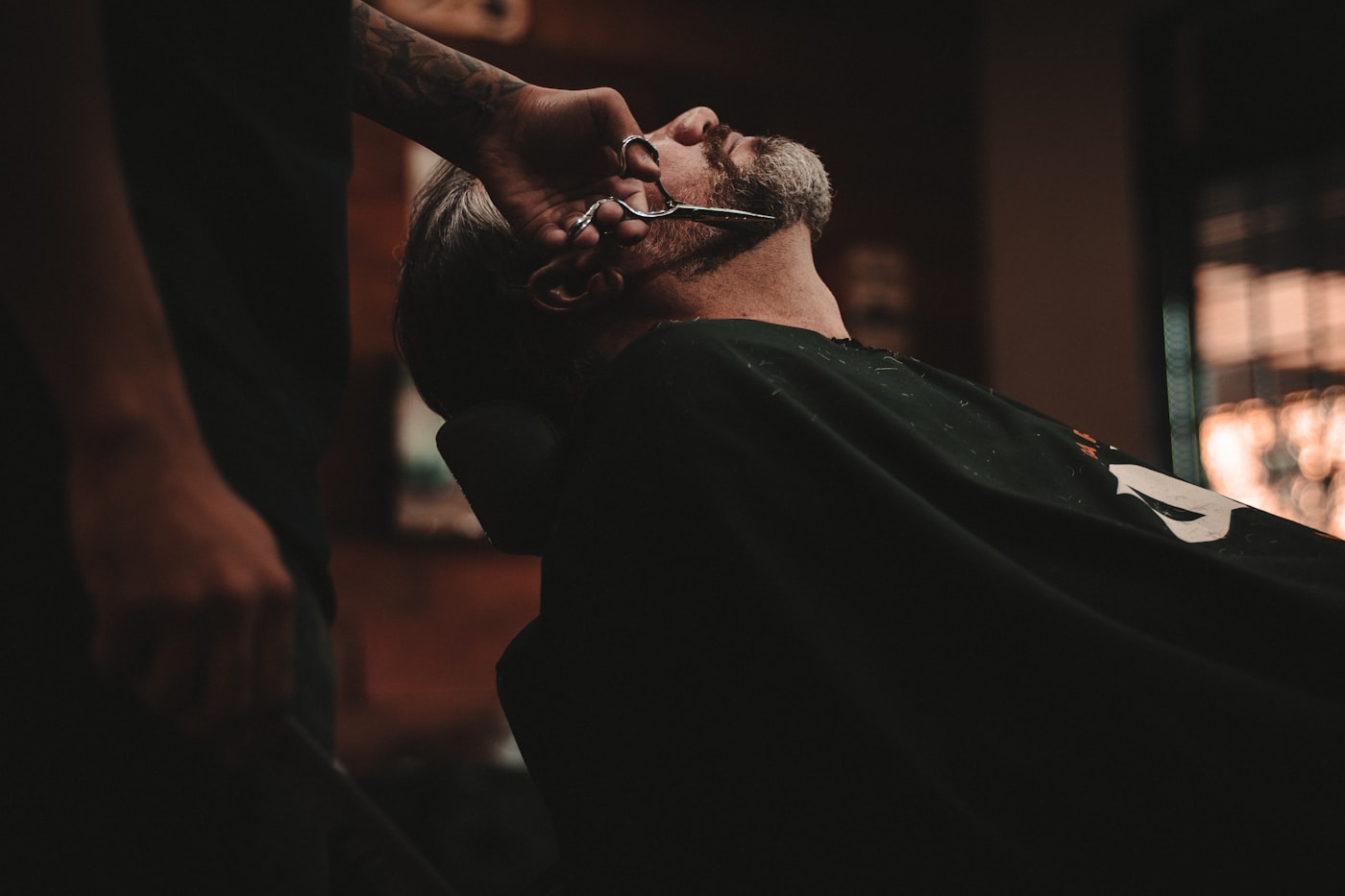 Barber giving a precision haircut