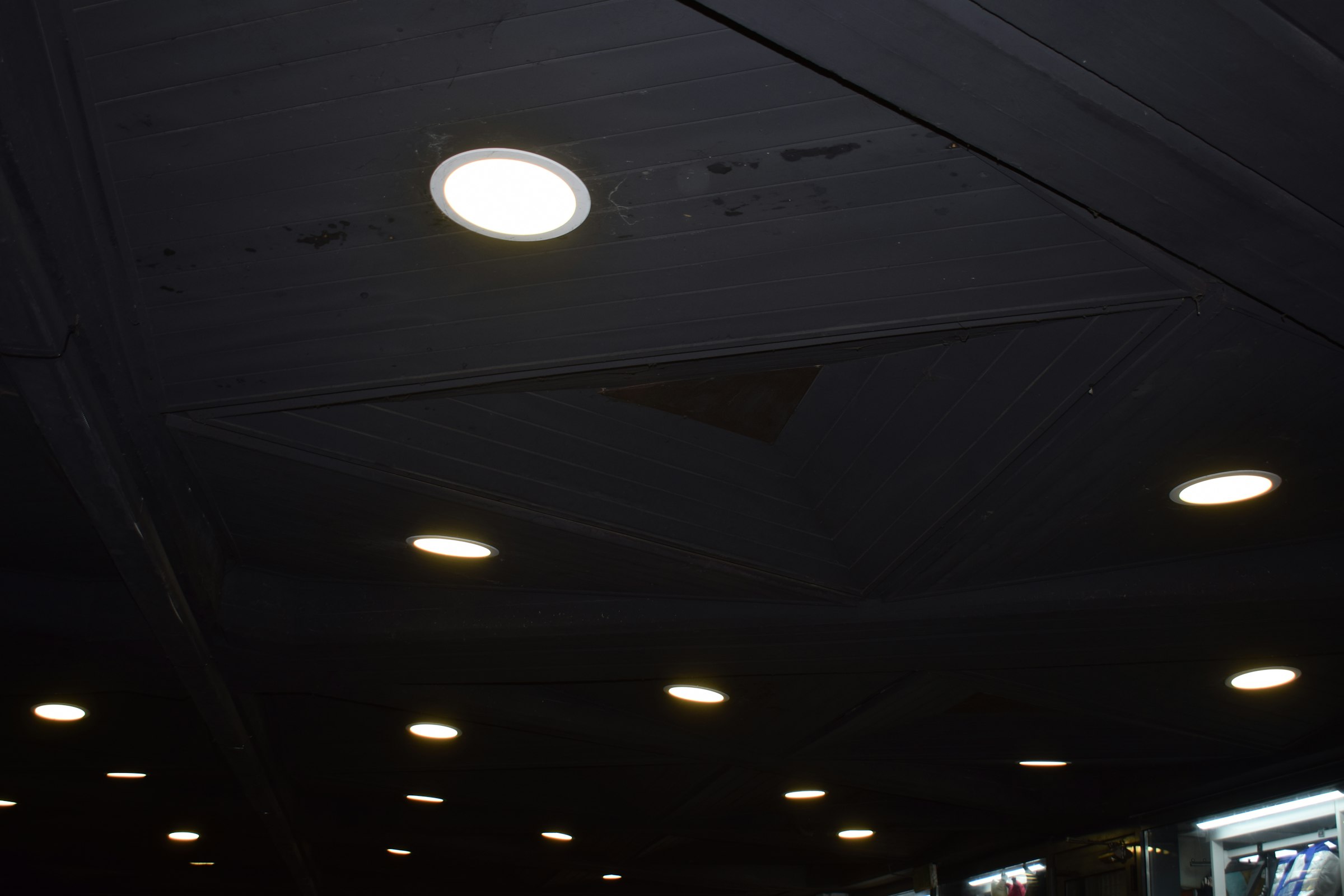 Recessed LED downlights in a dark ceiling