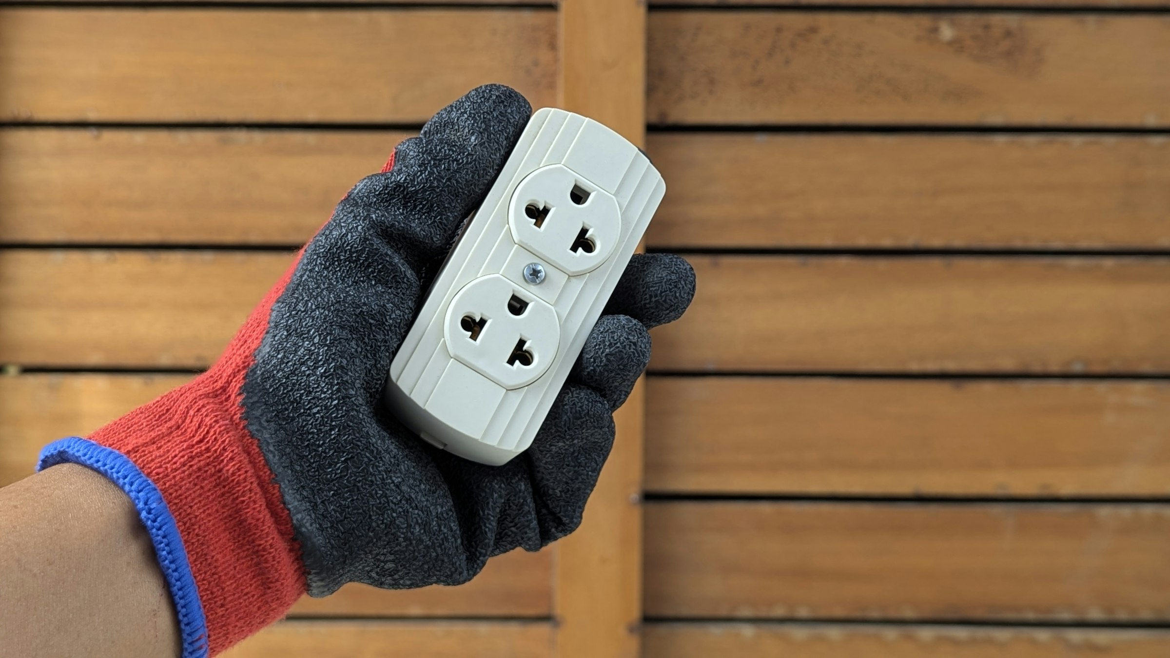 Gloved hand holding a new double power point